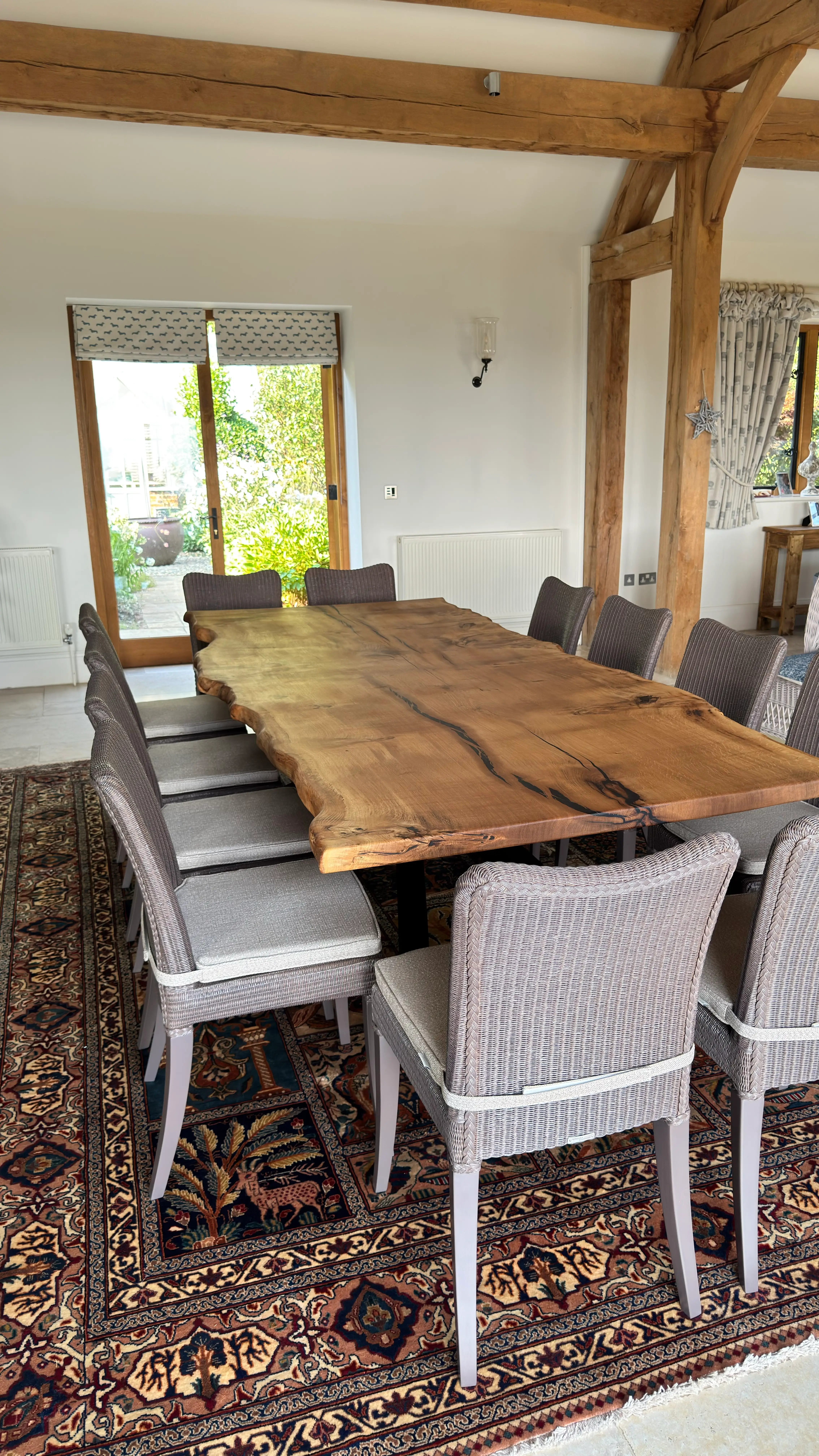 Live-edge timber dining table with woven dining chairs