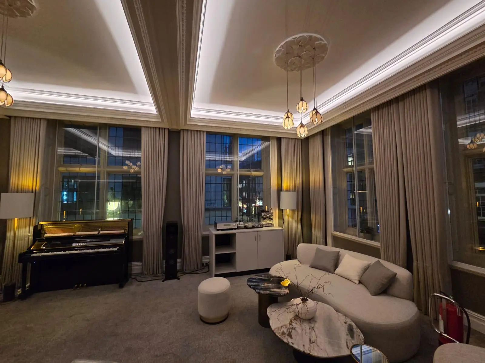 Curved sofa and stone-topped tables in the Yamaha Music boardroom