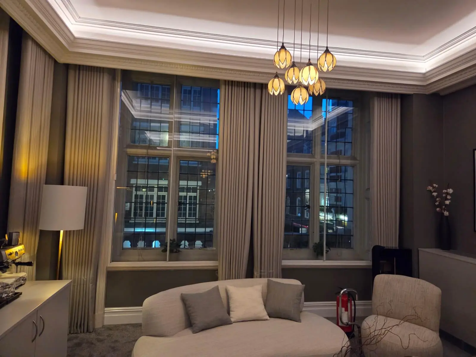Seating and floor lighting arranged around the room's piano